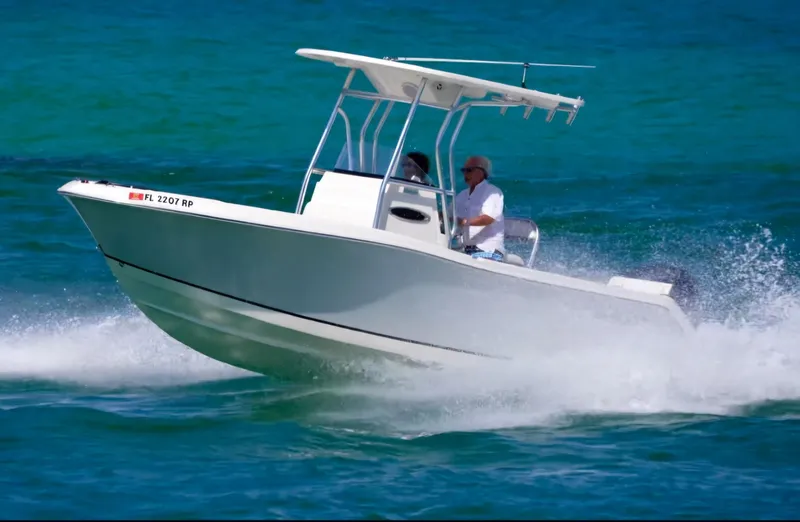 Slide: The Image of 2018 Release 208 SXC boat cruising on blue ocean waters. - 3