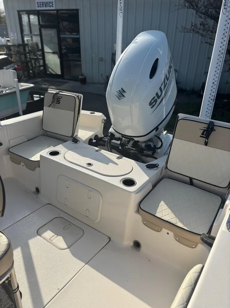 Slide: The Image of 2023 Carolina Skiff 21 LS boat interior with Suzuki outboard motor. - 4