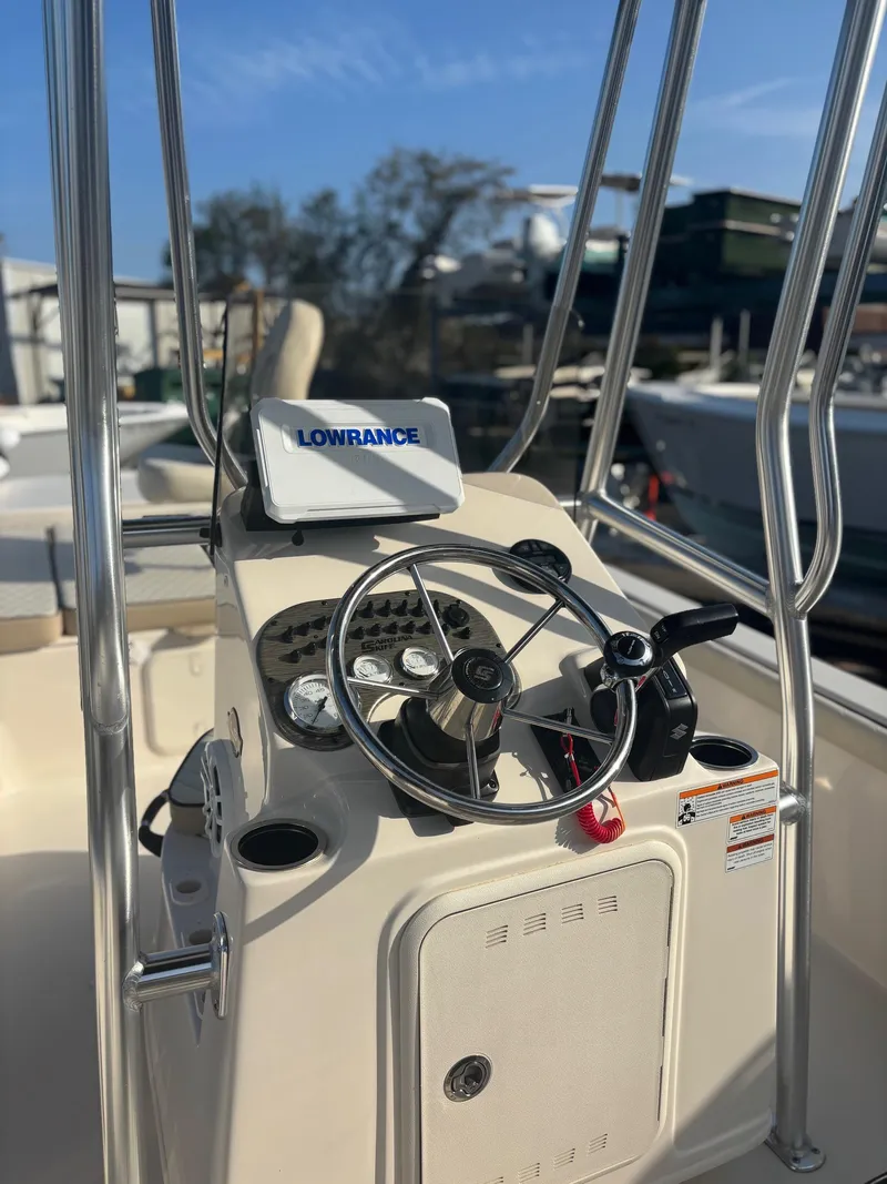 Slide: The Image of 2023 Carolina Skiff 21 LS boat console with steering wheel and Lowrance navigation system. - 5