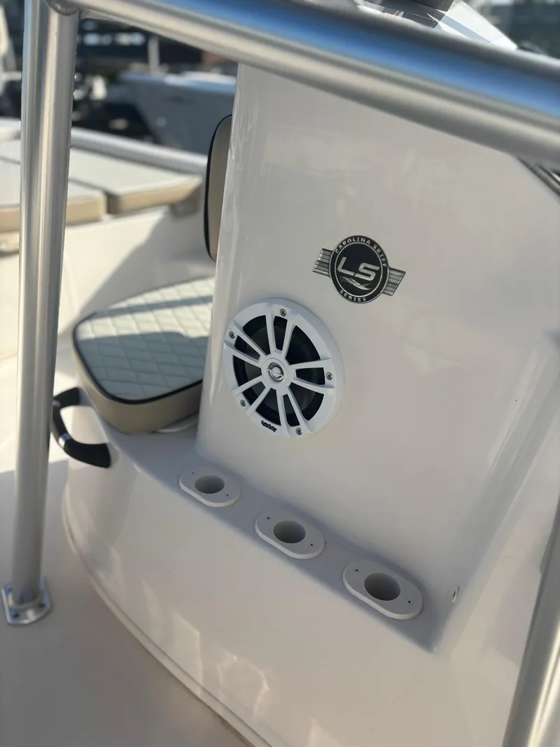 Slide: The Image of 2023 Carolina Skiff 21 LS boat console with speaker and rod holders. - 7