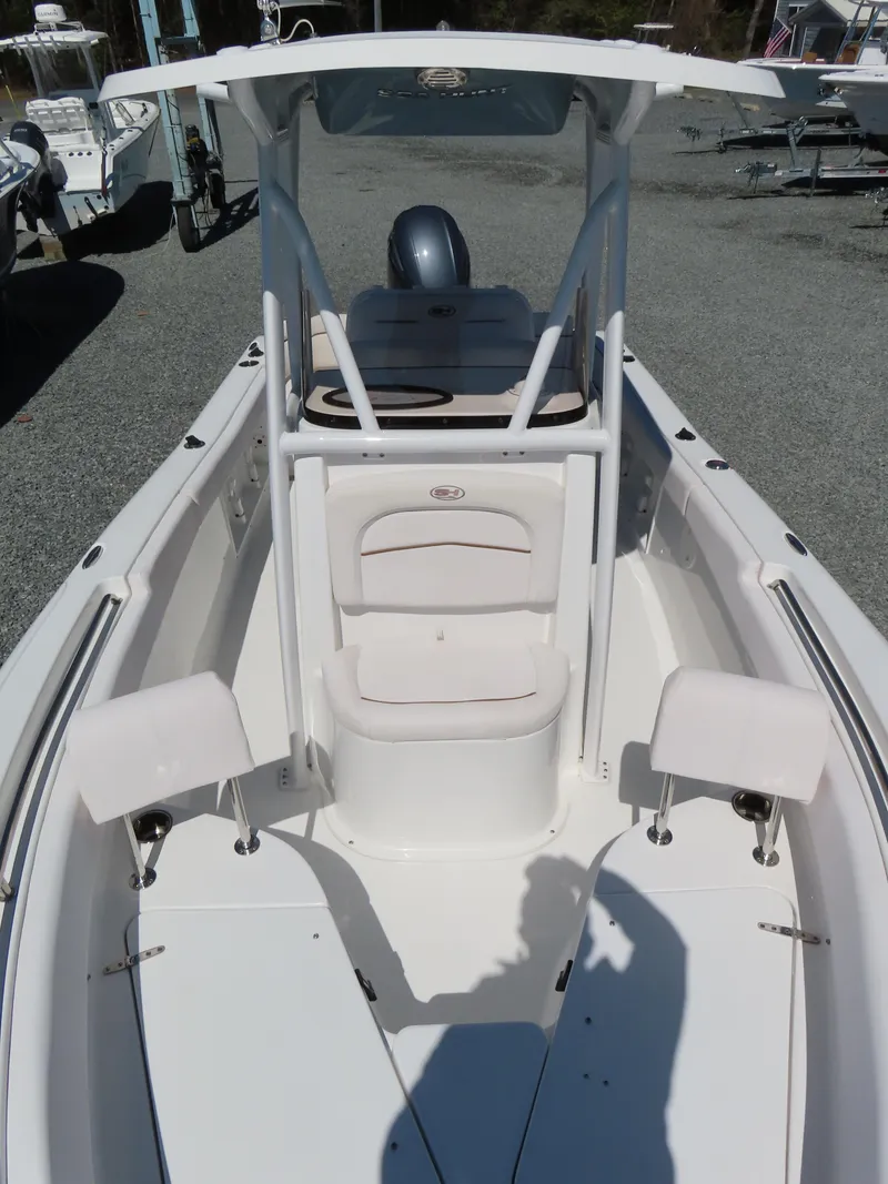 Slide: The Image of 2021 Sea Hunt Ultra 219 boat, white interior, center console, outdoor display. - 14