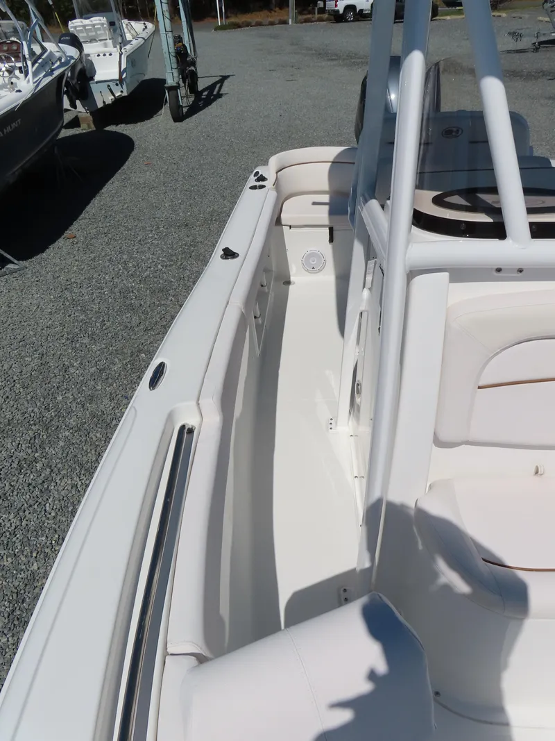 Slide: The Image of 2021 Sea Hunt Ultra 219 boat interior with seating and deck details. - 15