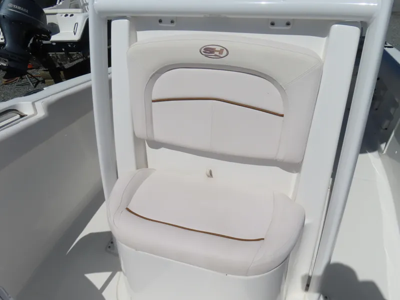 Slide: The Image of 2021 Sea Hunt Ultra 219 boat seat with white cushioned design. - 17