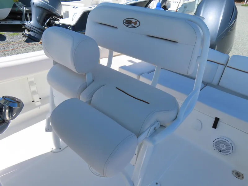 Slide: The Image of 2021 Sea Hunt Ultra 219 boat seating with white cushioned design. - 23