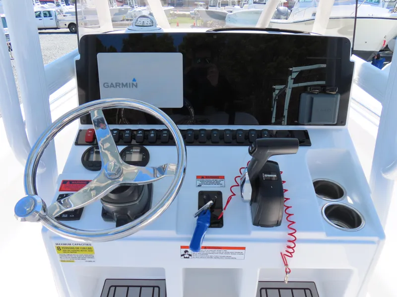 Slide: The Image of Control panel of a 2021 Sea Hunt Ultra 219 boat with Garmin navigation system. - 24