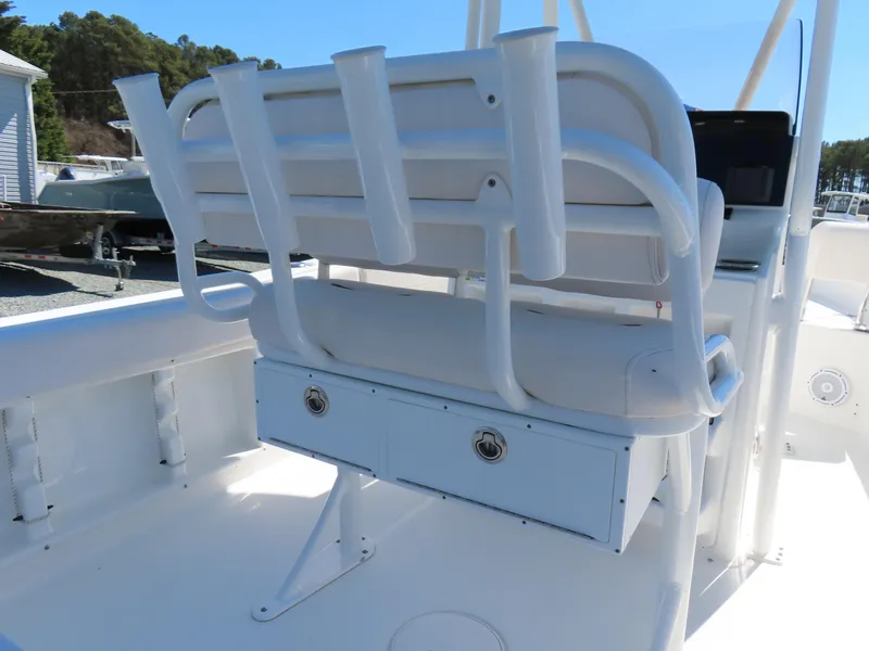 Slide: The Image of 2021 Sea Hunt Ultra 219 boat seating with rod holders and storage. - 30