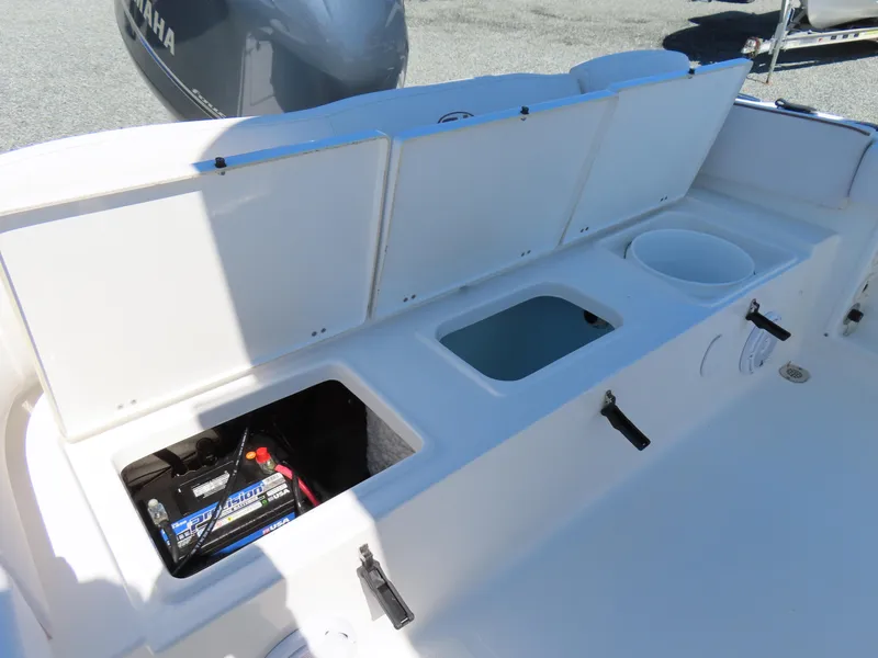 Slide: The Image of 2021 Sea Hunt Ultra 219 boat storage compartments and battery setup. - 35