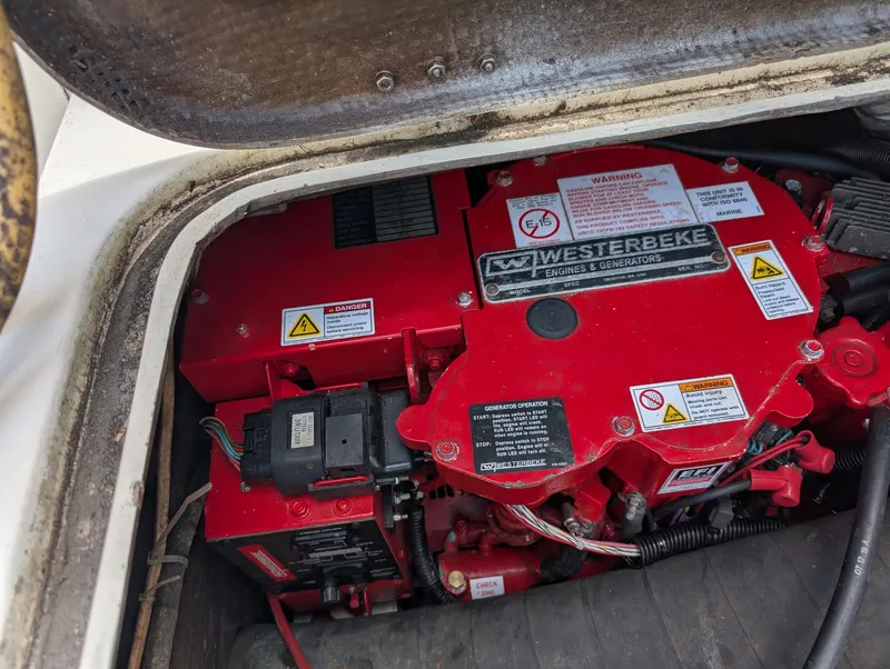 Slide: The Image of Engine compartment of a 1979 Bertram 28 Flybridge Cruiser with Westerbeke generator. - 14