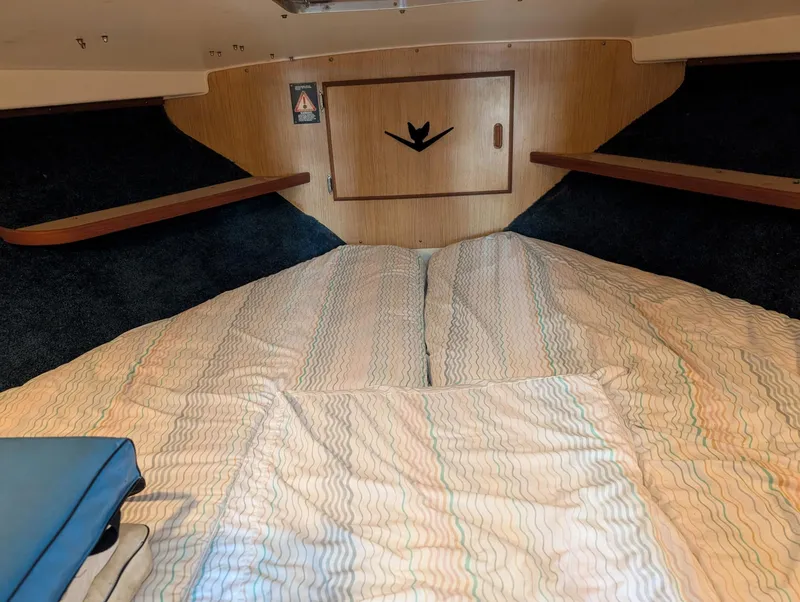 Slide: The Image of Interior cabin of 1979 Bertram 28 Flybridge Cruiser with cozy bedding. - 9