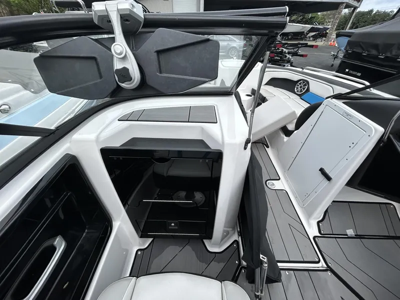Slide: The Image of 2019 Yamaha Boats 212X interior, featuring sleek design and modern amenities. - 12