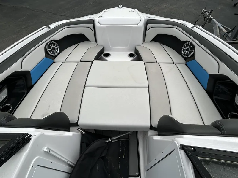 Slide: The Image of 2019 Yamaha Boats 212X interior with cushioned seating and speakers. - 3