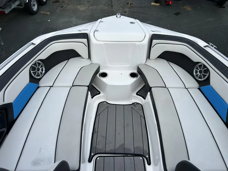 Slide: The Image of 2019 Yamaha Boats 212X interior with cushioned seating and speakers. - 6