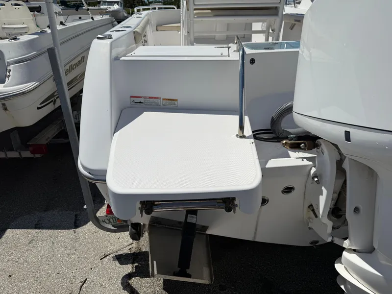 Slide: The Image of 2018 Everglades 230 Center Console boat with swim platform and motor detail. - 10