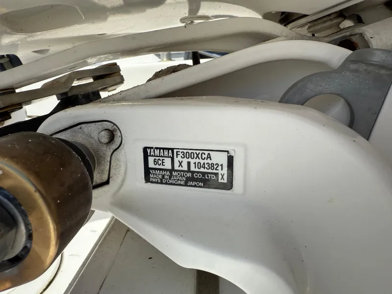 Slide: The Image of Yamaha F300XCA engine label on Everglades 230 Center Console, 2018 model. - 13