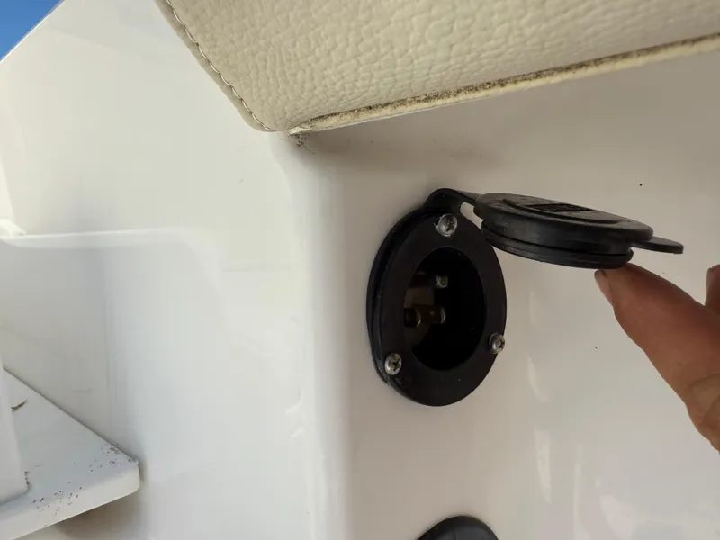 Slide: The Image of Power outlet on 2018 Everglades 230 Center Console boat, close-up view. - 21