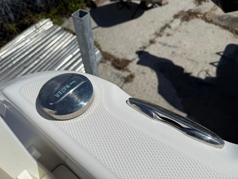Slide: The Image of Close-up of a 2018 Everglades 230 Center Console boat detail, showing a chrome fixture. - 22