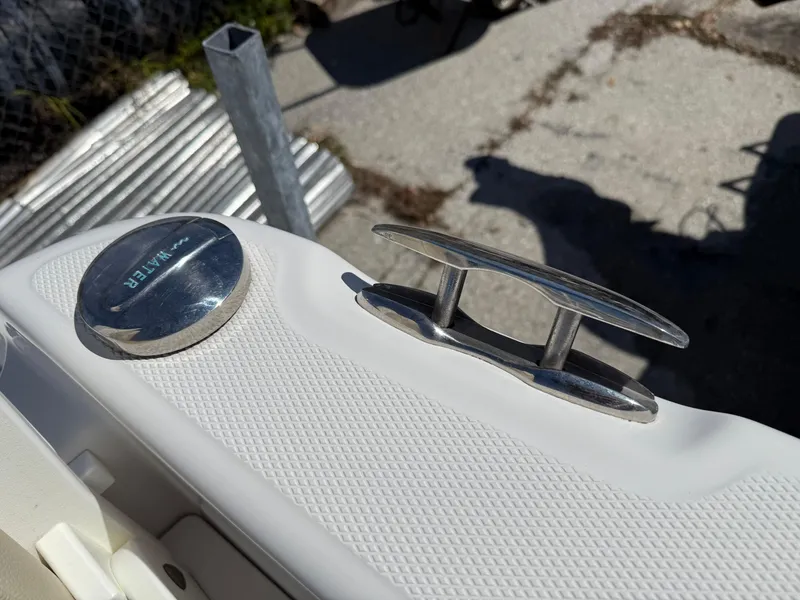 Slide: The Image of 2018 Everglades 230 Center Console boat cleat and fuel cap detail. - 23