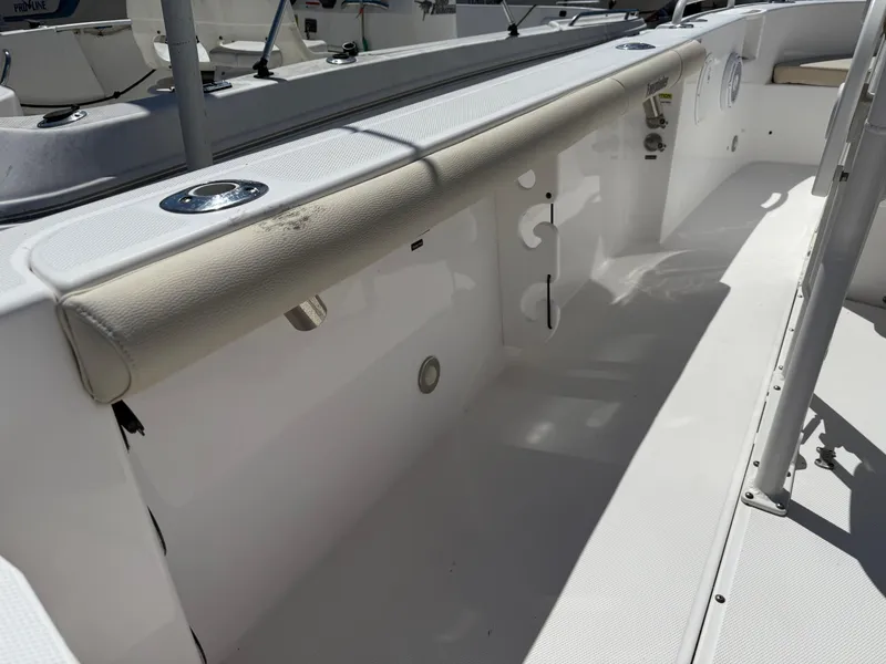 Slide: The Image of 2018 Everglades 230 Center Console boat interior with seating and storage compartments. - 29