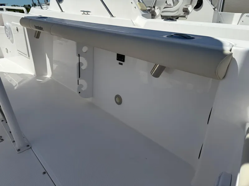 Slide: The Image of 2018 Everglades 230 Center Console boat interior, featuring sleek white design and modern fittings. - 30