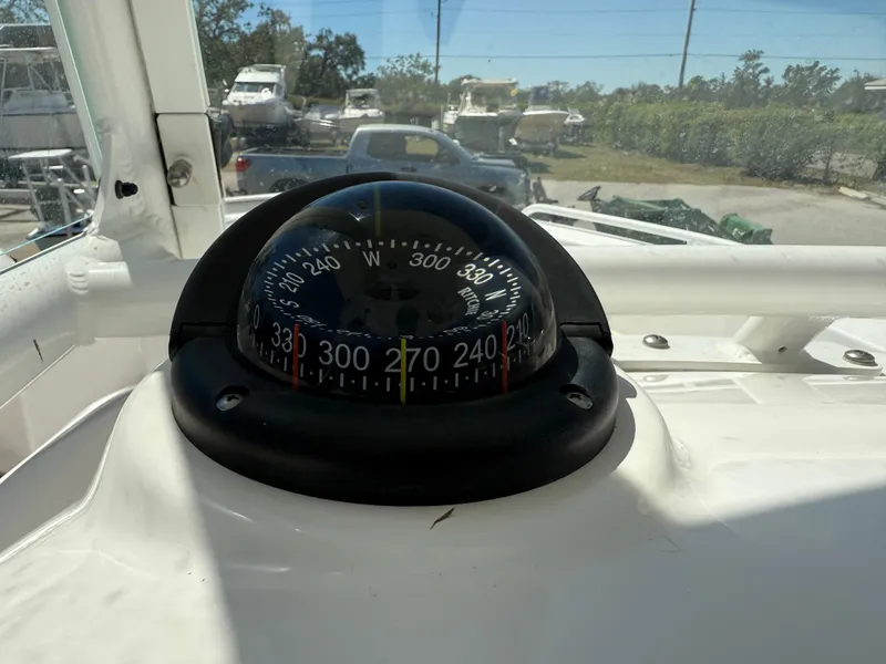 Slide: The Image of Compass on 2018 Everglades 230 Center Console boat dashboard. - 39