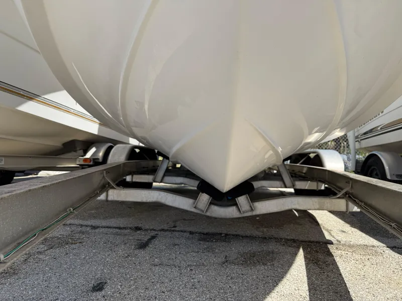 Slide: The Image of 2018 Everglades 230 Center Console boat on trailer, close-up of hull and trailer structure. - 4