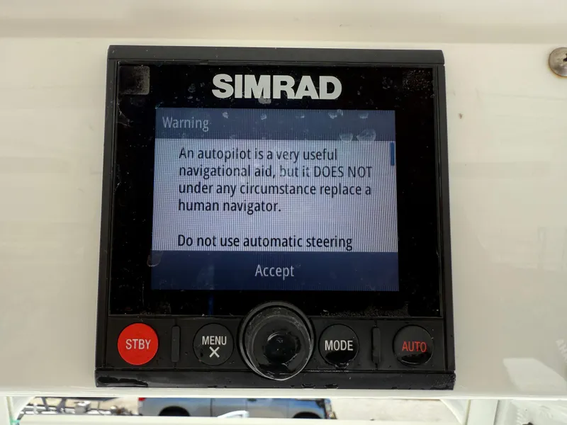 Slide: The Image of Simrad autopilot warning screen on 2018 Everglades 230 Center Console boat. - 42