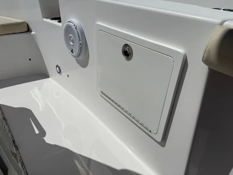 Slide: The Image of 2018 Everglades 230 Center Console boat interior with speaker and storage compartment. - 45