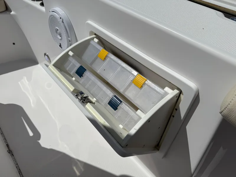 Slide: The Image of Storage compartment on 2018 Everglades 230 Center Console boat with tackle boxes. - 46