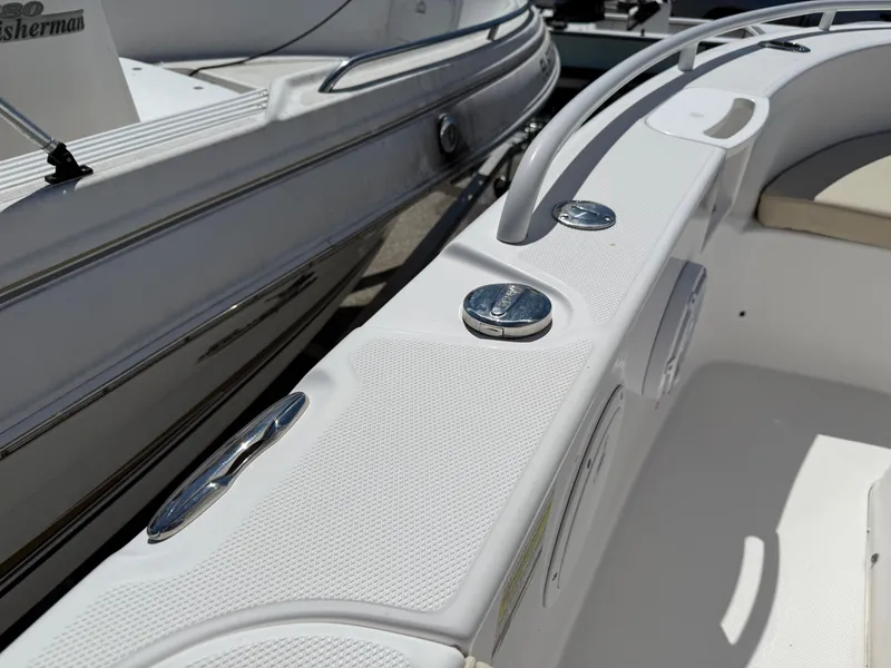 Slide: The Image of 2018 Everglades 230 Center Console boat interior with sleek white design and chrome fixtures. - 47