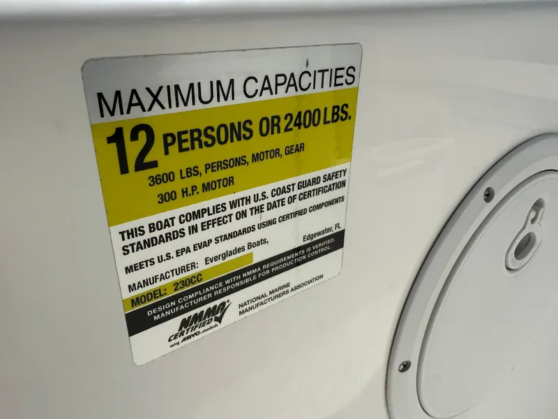 Slide: The Image of Capacity label on 2018 Everglades 230 Center Console boat, max 12 persons or 2400 lbs. - 48
