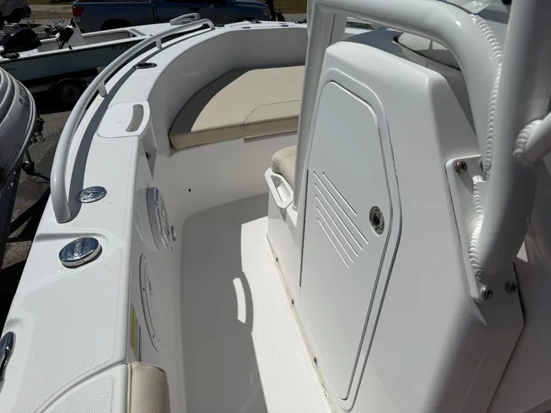 Slide: The Image of 2018 Everglades 230 Center Console boat interior with seating and storage compartment. - 49