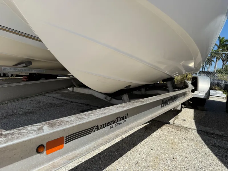 Slide: The Image of Trailer with 2018 Everglades 230 Center Console boat, AmeraTrail branding visible. - 5