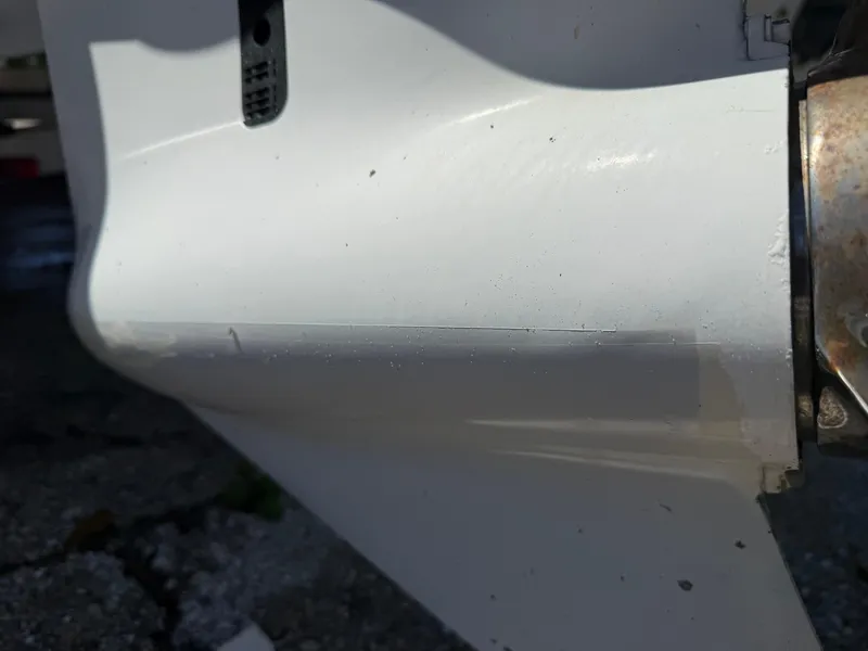 Slide: The Image of Close-up of a 2018 Everglades 230 Center Console boat's white hull detail. - 9