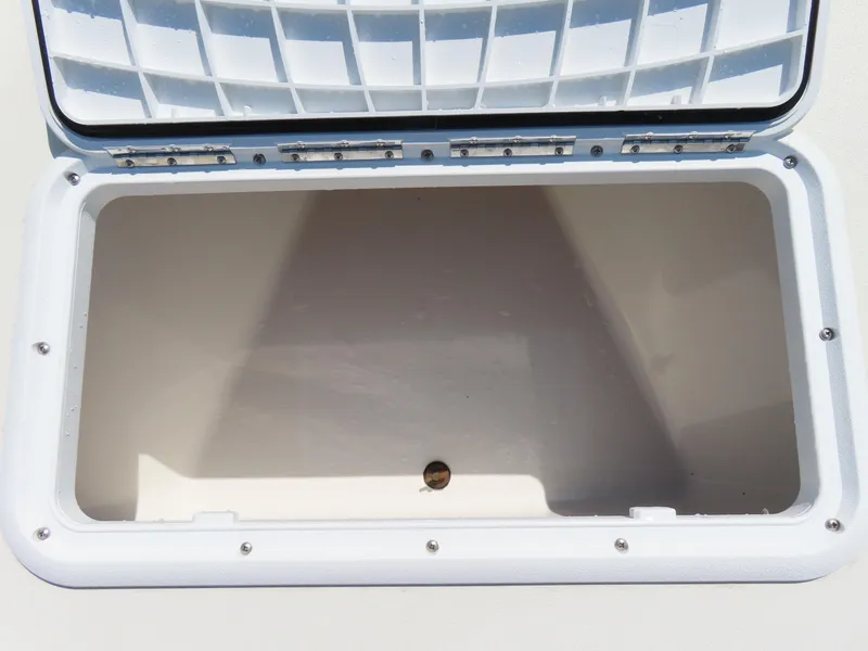 Slide: The Image of Open storage compartment on a 2018 Parker 1801 Center Console boat. - 10