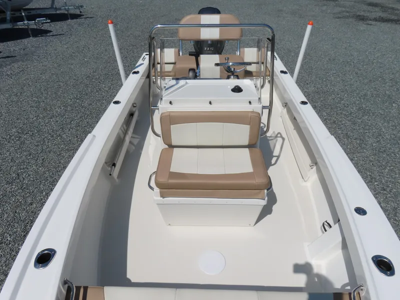 Slide: The Image of 2018 Parker 1801 Center Console boat with beige seating and steering console. - 13