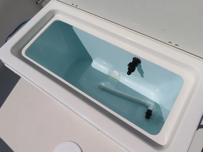 Slide: The Image of Livewell compartment on a 2018 Parker 1801 Center Console boat, open and empty. - 17