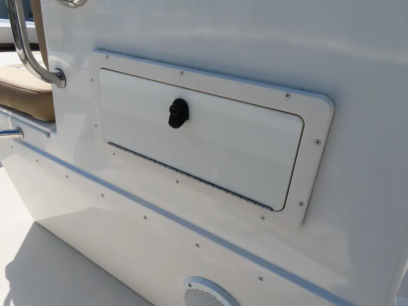 Slide: The Image of 2018 Parker 1801 Center Console boat storage compartment with handle and speaker. - 18