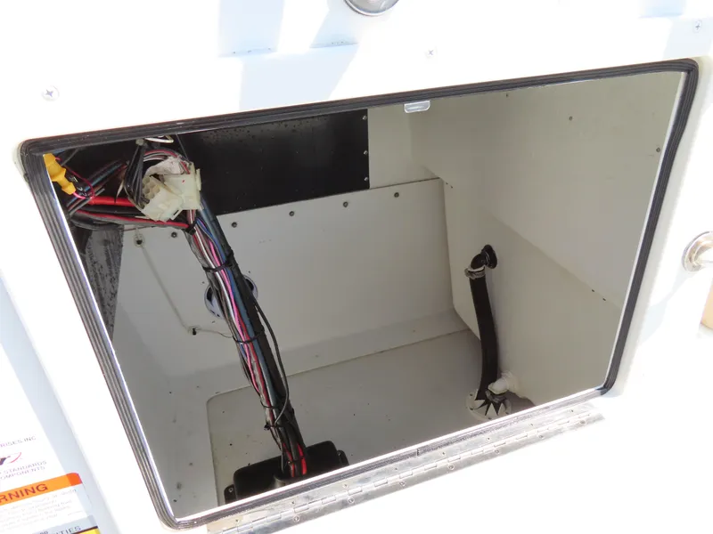 Slide: The Image of 2018 Parker 1801 Center Console storage compartment with visible wiring. - 21