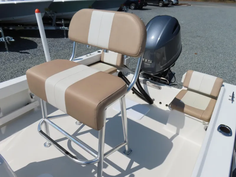 Slide: The Image of 2018 Parker 1801 Center Console boat with beige seating and outboard motor. - 22