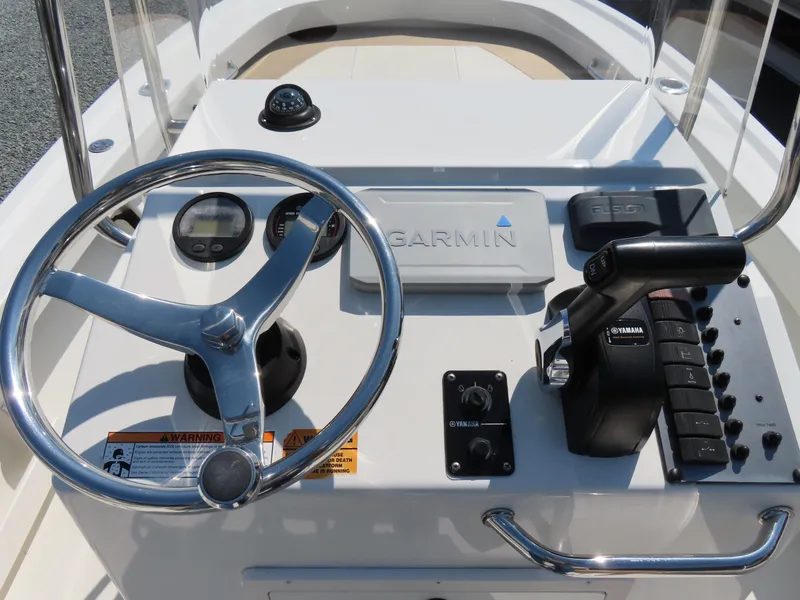 Slide: The Image of 2018 Parker 1801 Center Console boat dashboard with Garmin navigation and Yamaha controls. - 24
