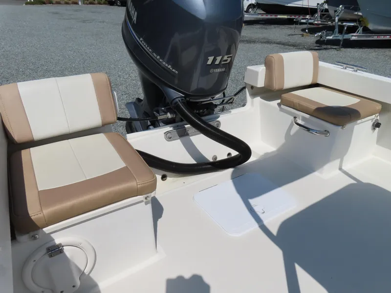 Slide: The Image of 2018 Parker 1801 Center Console boat interior with Yamaha 115 engine and cushioned seating. - 26