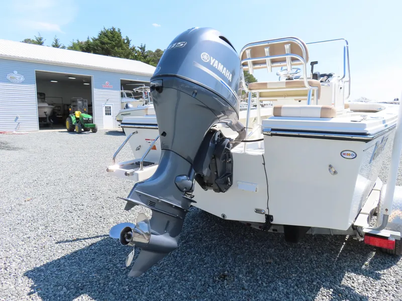 Slide: The Image of 2018 Parker 1801 Center Console boat with Yamaha outboard motor in a gravel lot. - 4
