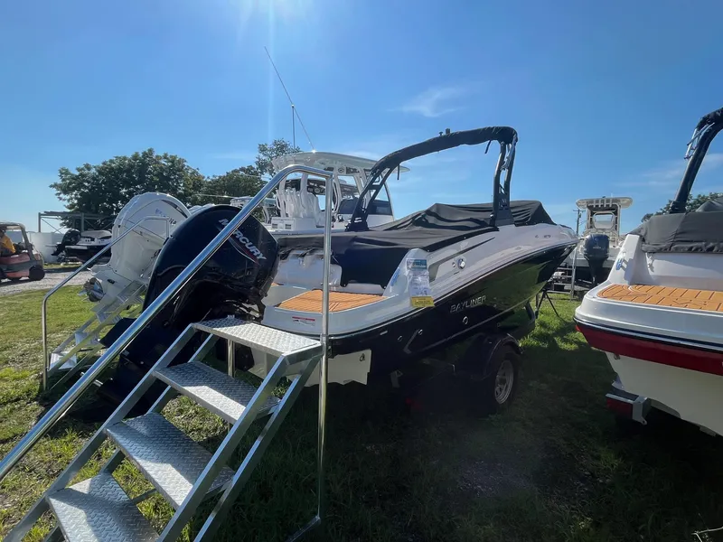 Slide: The Image of 2025 Bayliner VR5 Bowrider OB with Mercury outboard engine on display. - 10