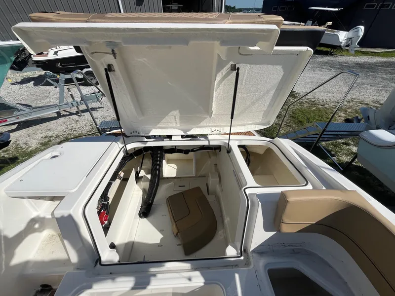 Slide: The Image of 2025 Bayliner VR5 Bowrider OB open storage compartment, showcasing interior design and features. - 17