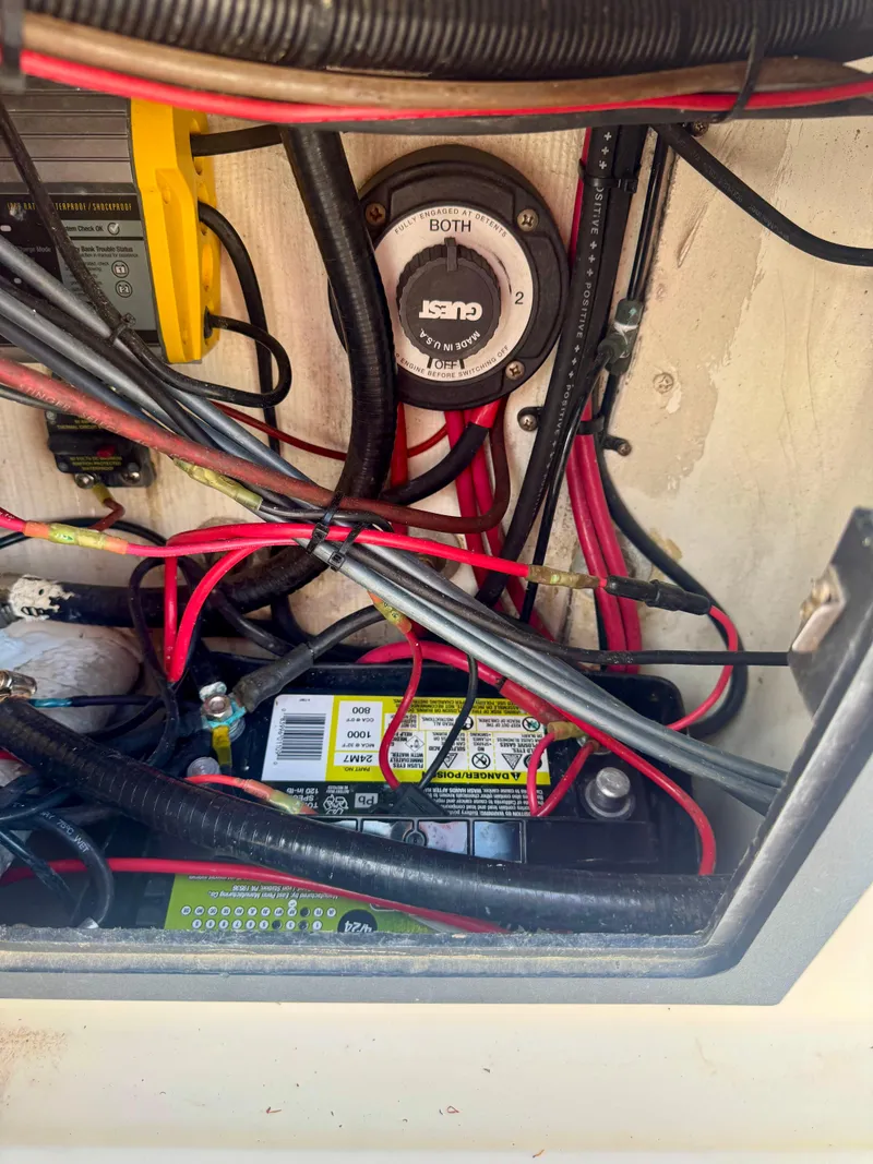 Slide: The Image of Electrical wiring and battery setup in a 1998 Regulator 26 Express boat. - 15