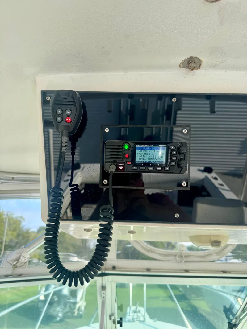 Slide: The Image of VHF radio system on 1998 Regulator 26 Express boat dashboard. - 16