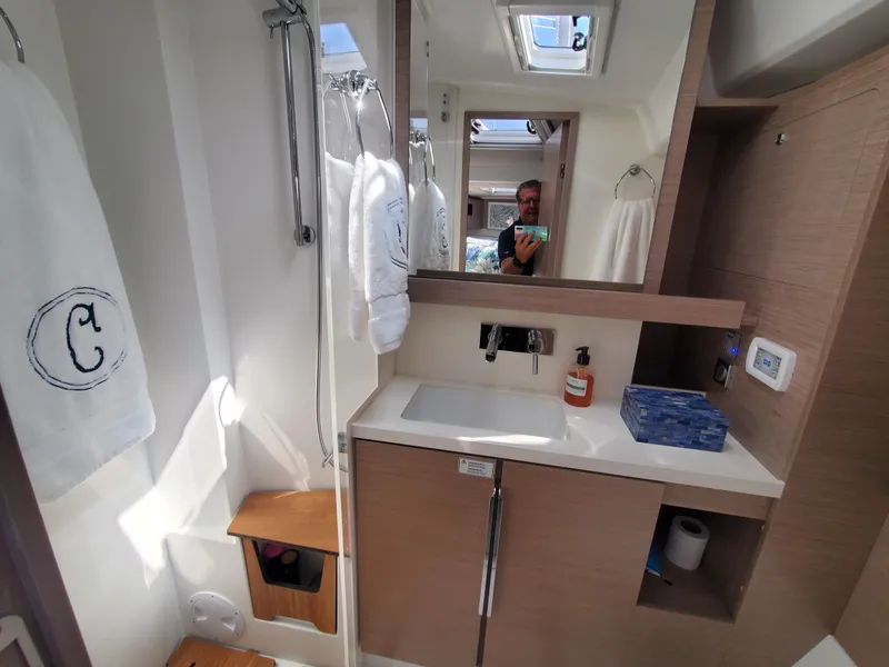 Slide: The Image of Modern bathroom interior of 2023 Hanse 460 yacht, featuring sleek design and amenities. - 12