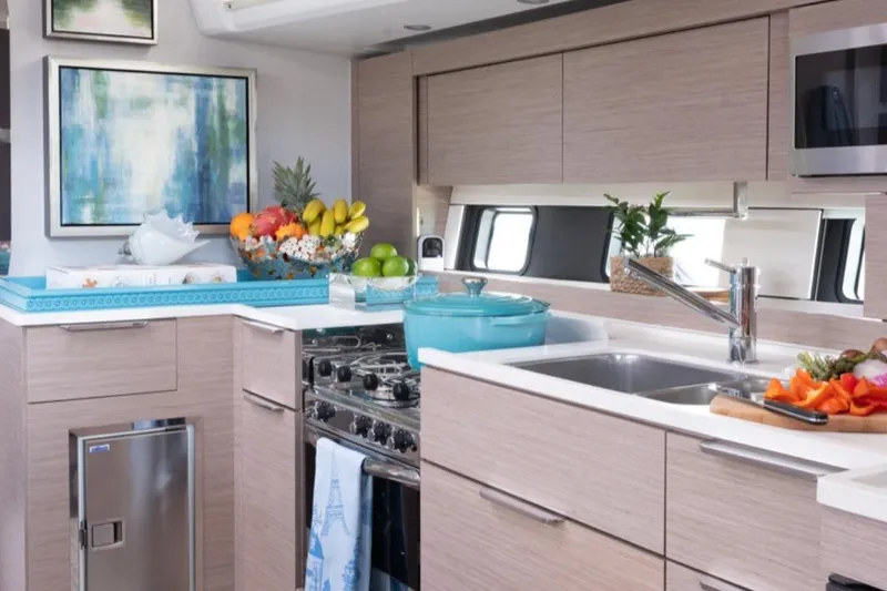 Slide: The Image of Modern kitchen interior on 2023 Hanse 460 yacht with sleek cabinetry and vibrant decor. - 15