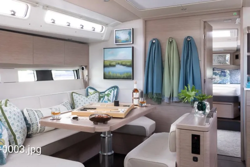 Slide: The Image of Luxurious interior of 2023 Hanse 460 yacht with elegant dining area and modern decor. - 16