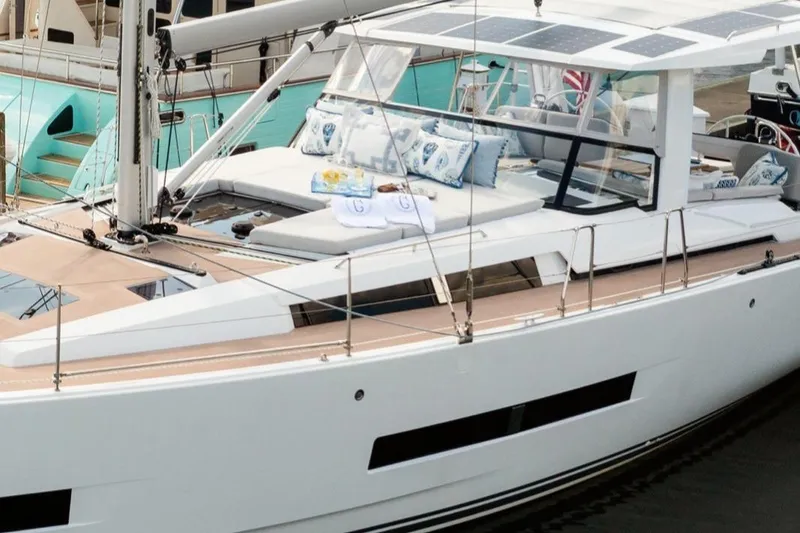 Slide: The Image of 2023 Hanse 460 yacht with sleek design and spacious deck, featuring modern amenities. - 2